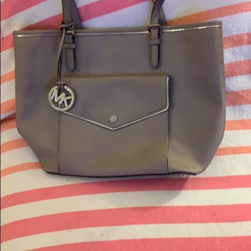 grey Michael Kors purse.